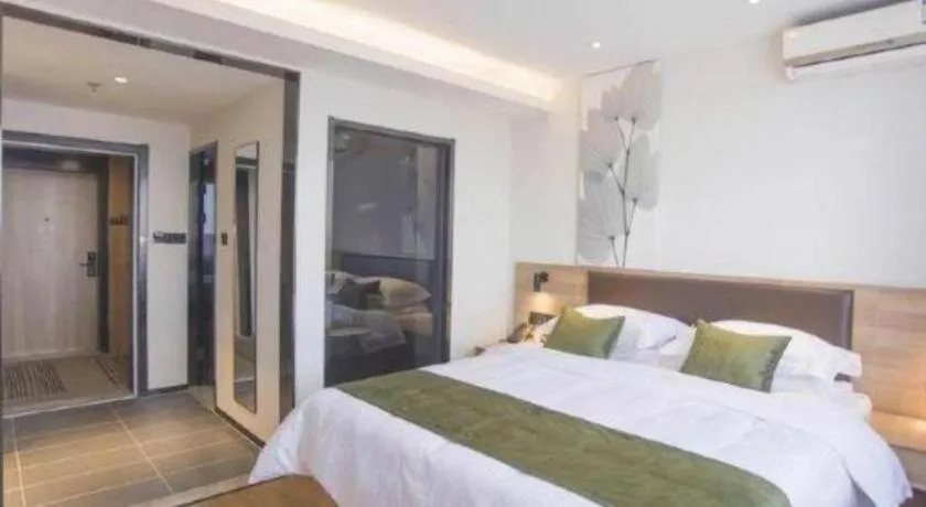 Bed in GreenTree Inn Express Taizhou Jiangyan Hardware City