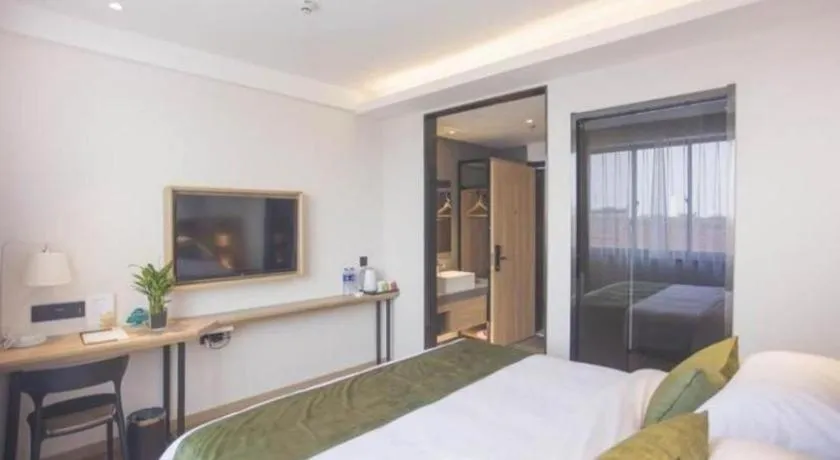 Bed in GreenTree Inn Express Taizhou Jiangyan Hardware City