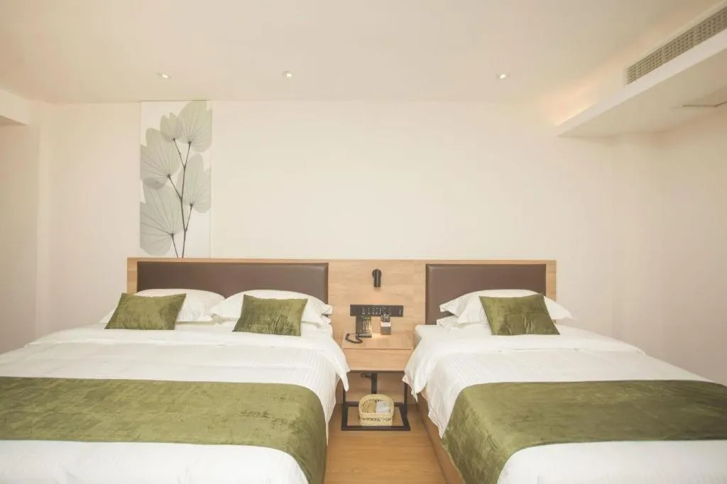 Bed in GreenTree Inn Express Taizhou Jiangyan Hardware City