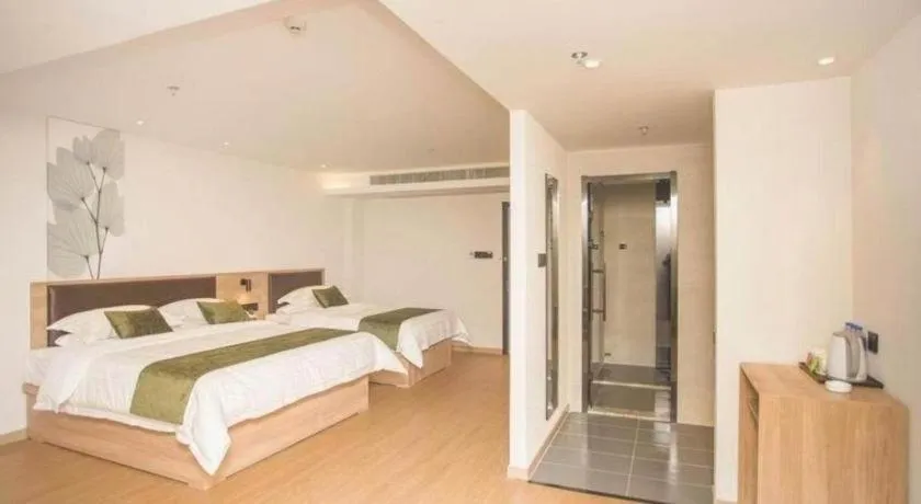 Bed in GreenTree Inn Express Taizhou Jiangyan Hardware City