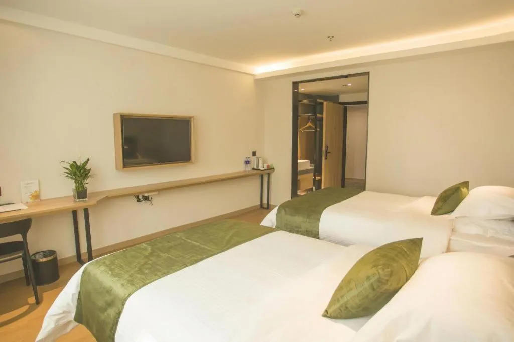 Bed in GreenTree Inn Express Taizhou Jiangyan Hardware City