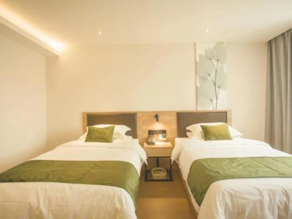 Bed in GreenTree Inn Express Taizhou Jiangyan Hardware City