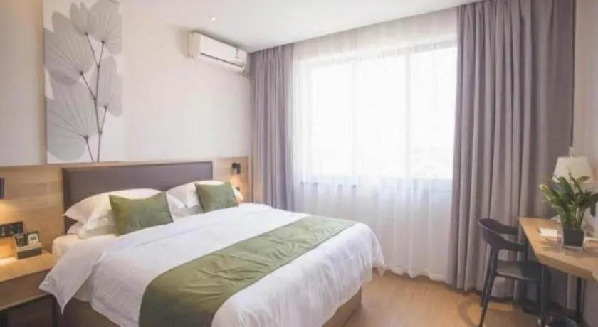 Bed in GreenTree Inn Express Taizhou Jiangyan Hardware City