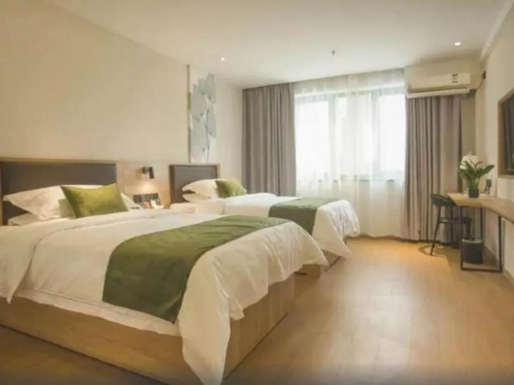 Bed in GreenTree Inn Express Taizhou Jiangyan Hardware City