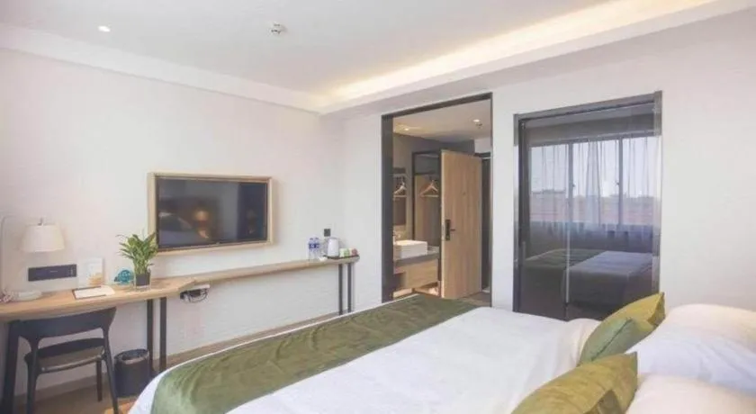 Bed in GreenTree Inn Express Taizhou Jiangyan Hardware City