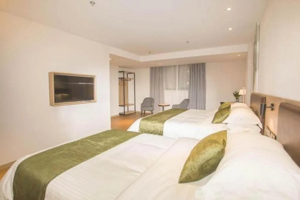 Bed in GreenTree Inn Express Taizhou Jiangyan Hardware City