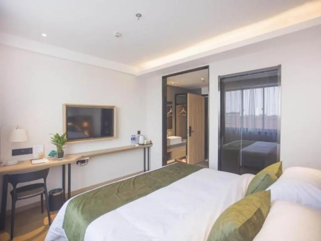 Bed in GreenTree Inn Express Taizhou Jiangyan Hardware City