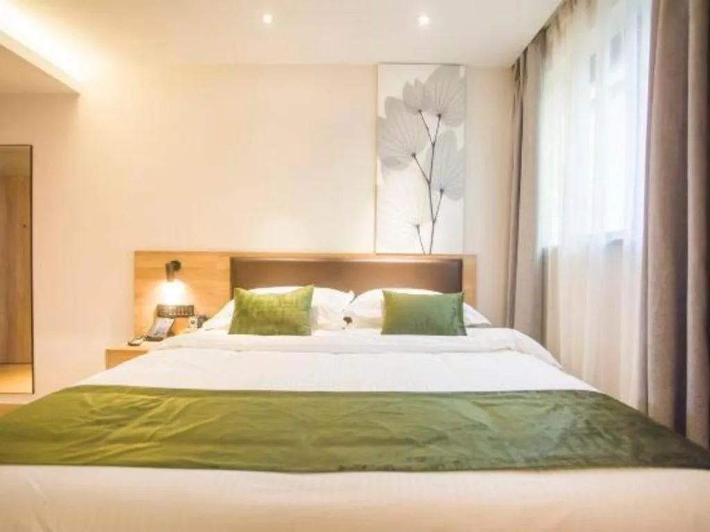Bed in GreenTree Inn Express Taizhou Jiangyan Hardware City