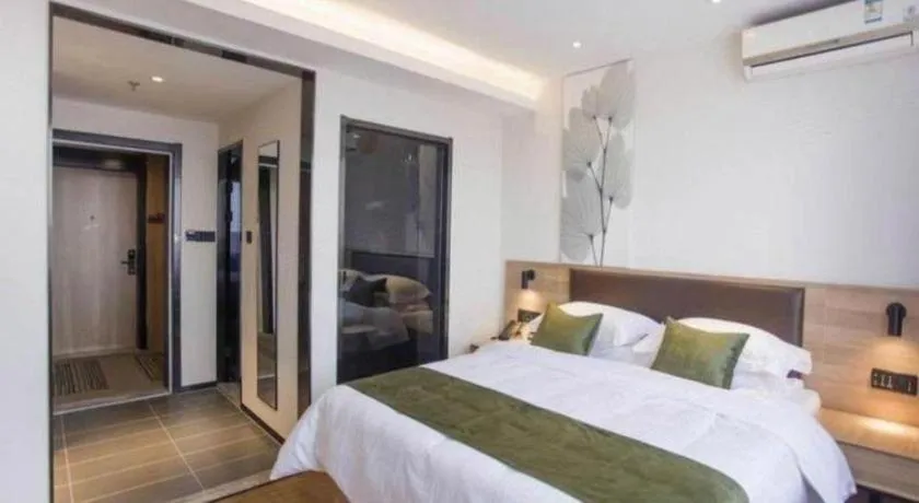 Bed in GreenTree Inn Express Taizhou Jiangyan Hardware City