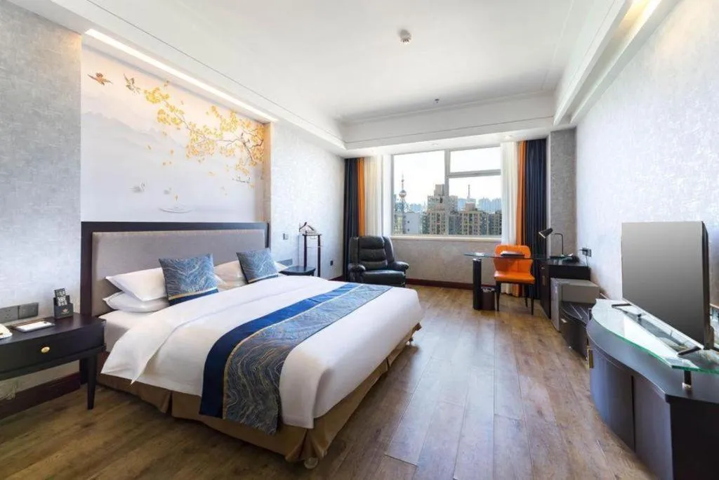 Bed in Junyu Grand Hotel Qinhuangdao