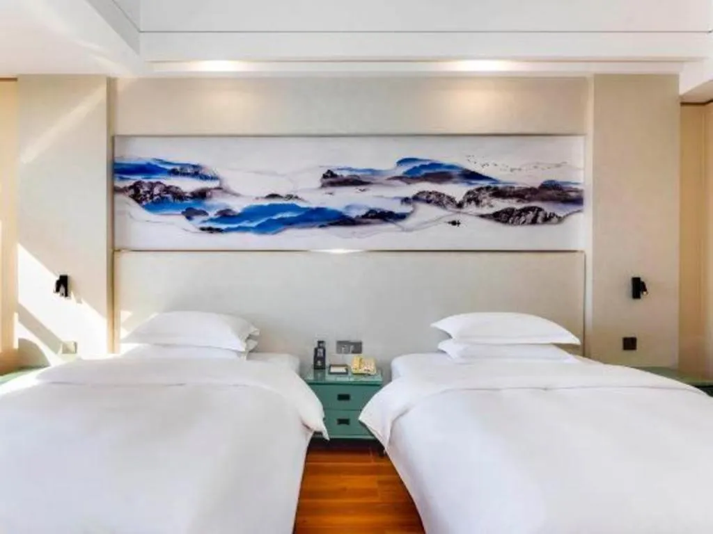 Bed in Junyu Grand Hotel Qinhuangdao