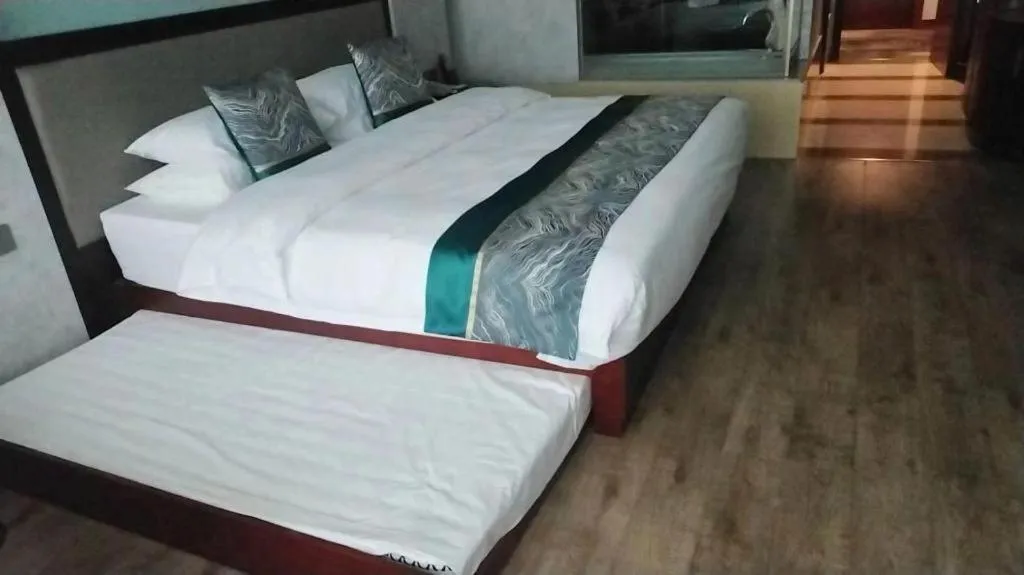 Bed in Junyu Grand Hotel Qinhuangdao