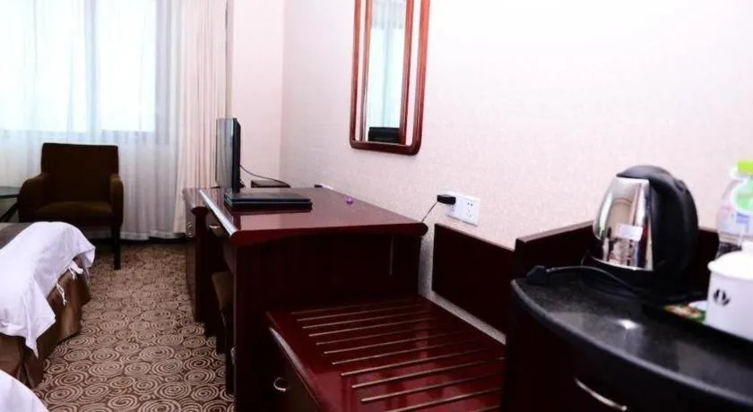 Bed in Heilongjiang Kunlun Hotel