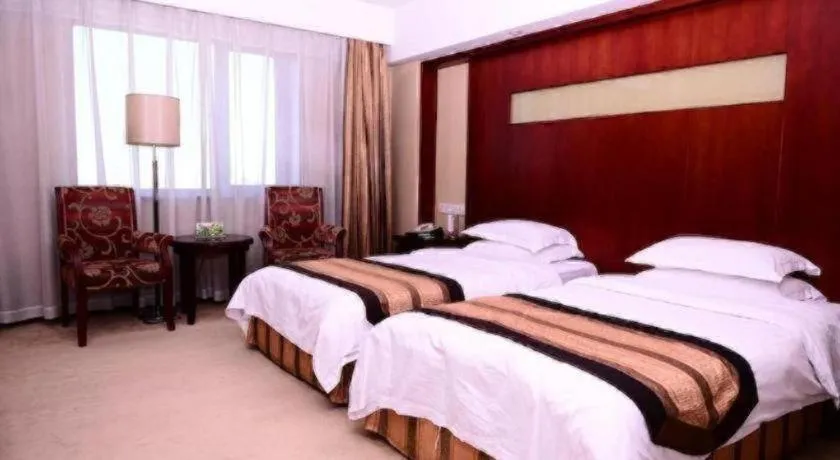 Bed in Heilongjiang Kunlun Hotel