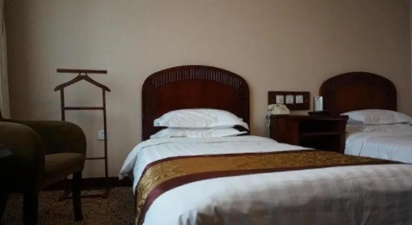 Bed in Heilongjiang Kunlun Hotel