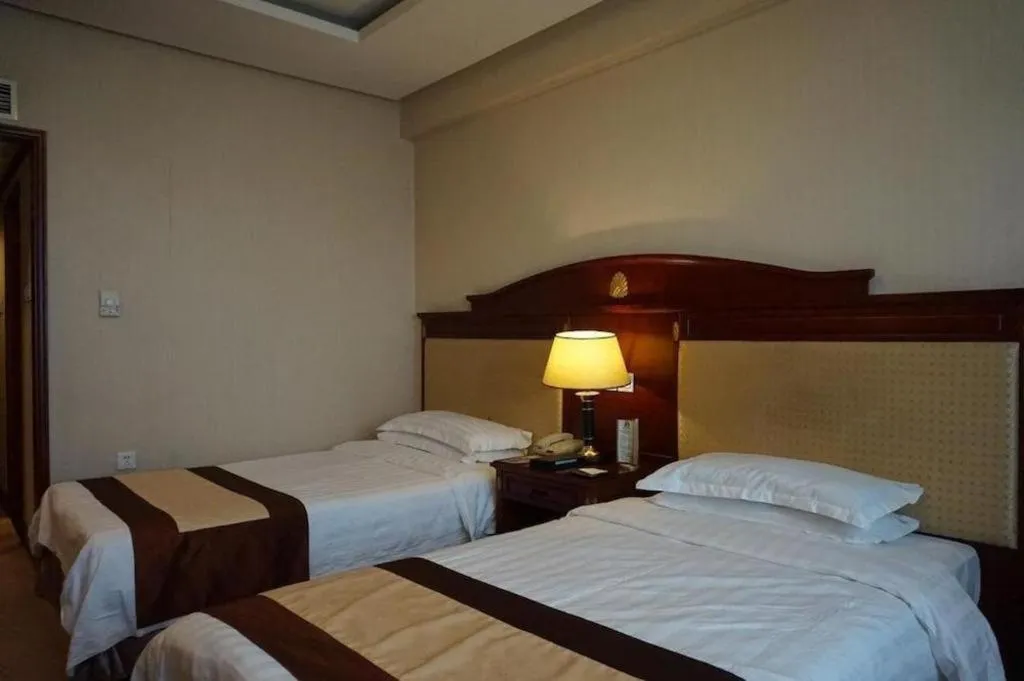 Bed in Heilongjiang Kunlun Hotel