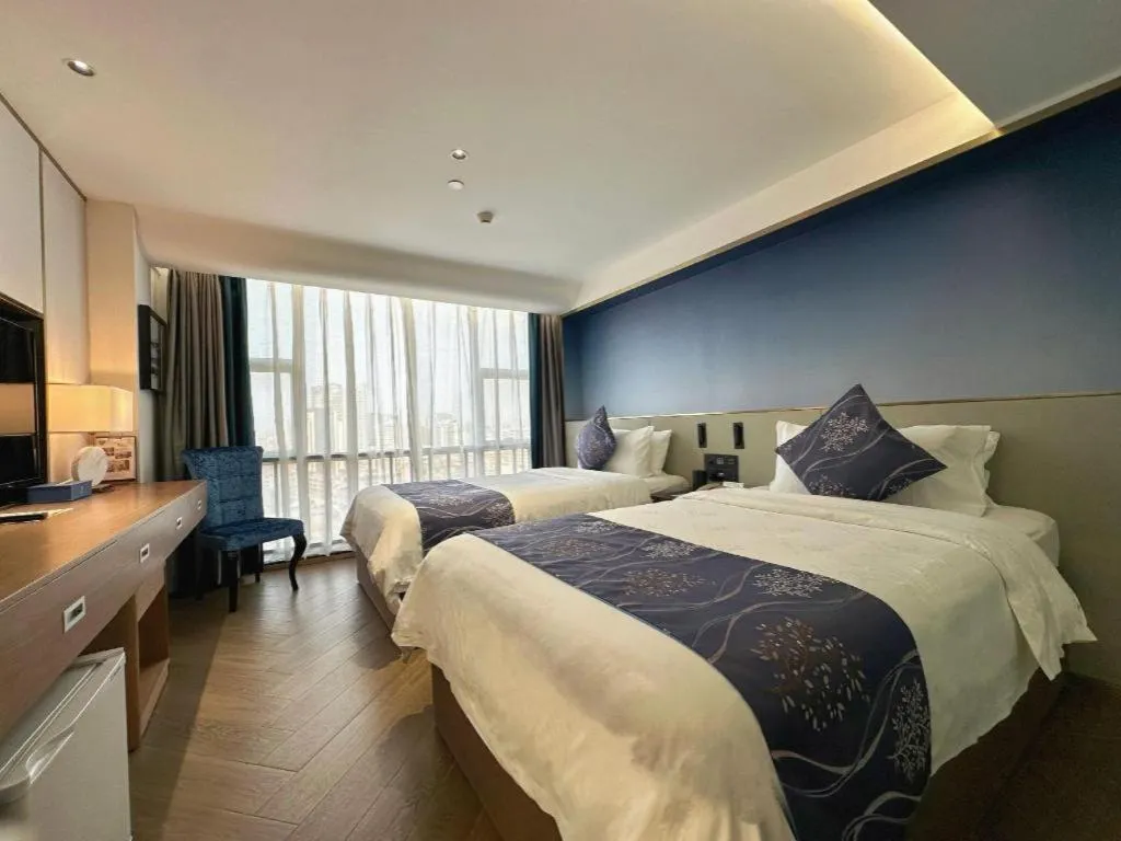 Bed in Xinyuan Hot Spring Hotel