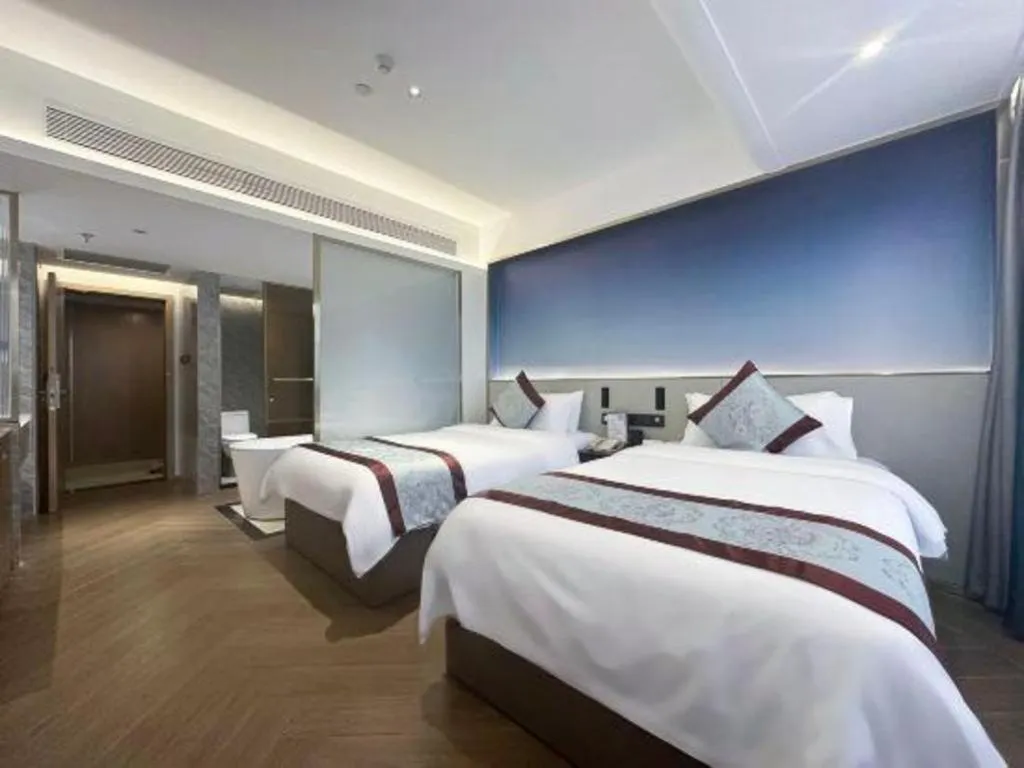 Bed in Xinyuan Hot Spring Hotel