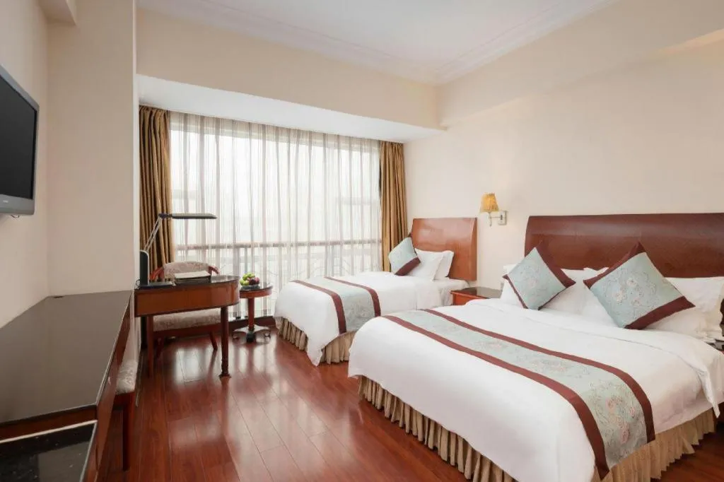 Bed in Xinyuan Hot Spring Hotel