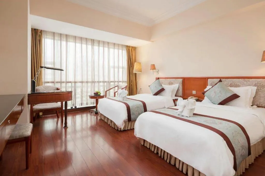 Bed in Xinyuan Hot Spring Hotel