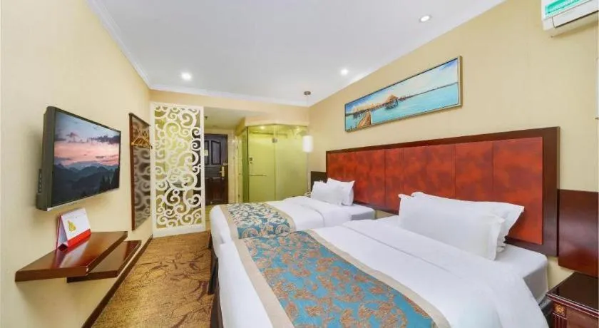 Bed in Sun Island Holiday Hotel