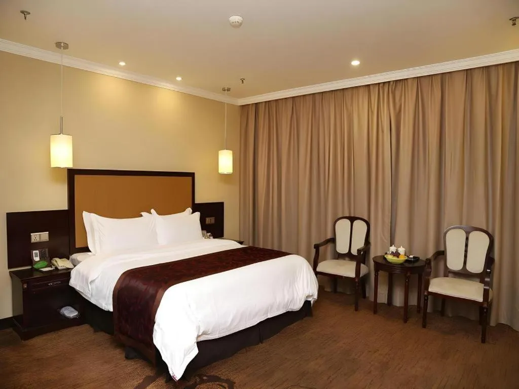 Bed in Sun Island Holiday Hotel