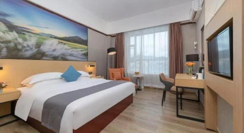 Bed in GreenTree Inn Zhongshan Nanlang Metro Station Branch