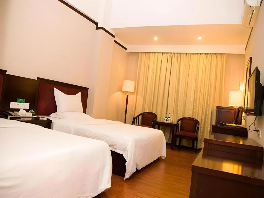 Bed in GreenTree Inn Zhongshan Nanlang Metro Station Branch