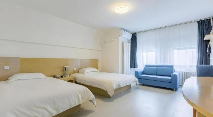 Bed in Jinjiang Inn Qingdao Wuxi Square Nanjing Road Metro Station