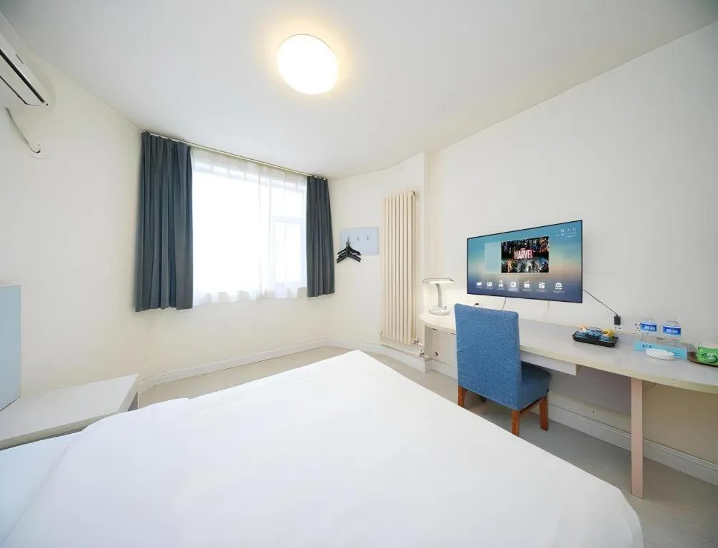 Bed in Jinjiang Inn Qingdao Wuxi Square Nanjing Road Metro Station