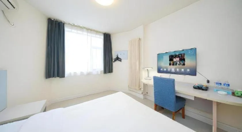 Bed in Jinjiang Inn Qingdao Wuxi Square Nanjing Road Metro Station