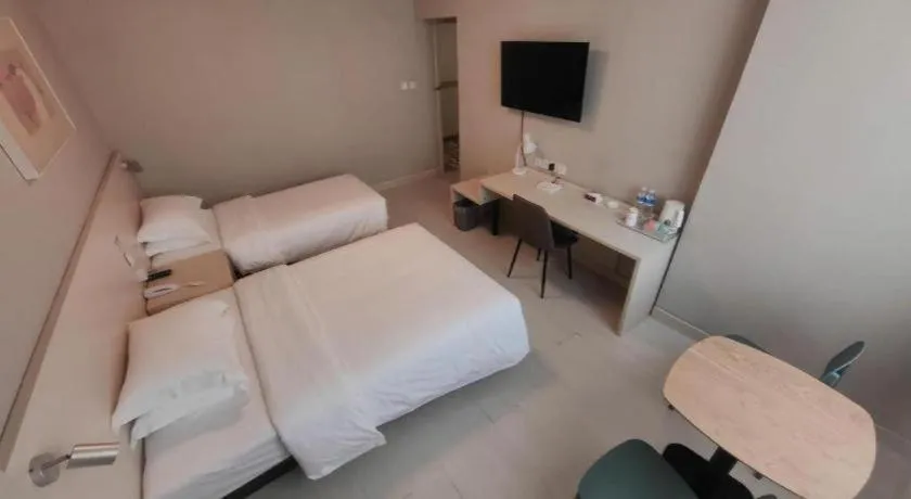 Bed in Jinjiang Inn Qingdao International Exhibition Center Haier Road