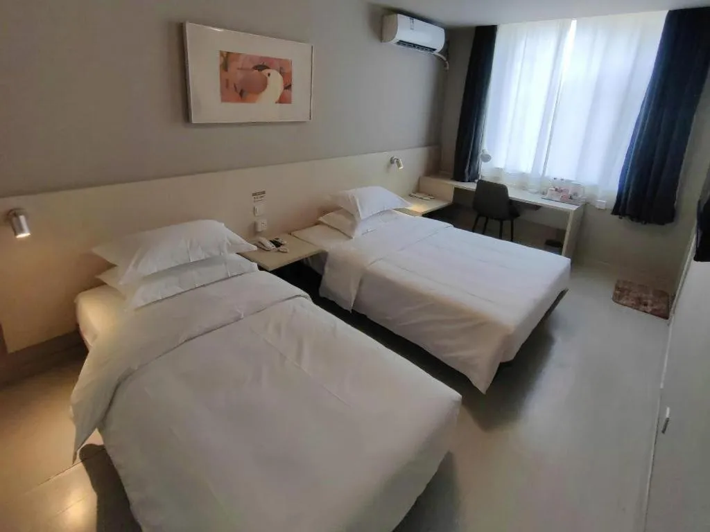 Bed in Jinjiang Inn Qingdao International Exhibition Center Haier Road