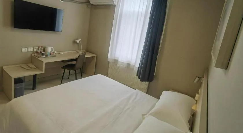 Bed in Jinjiang Inn Qingdao International Exhibition Center Haier Road