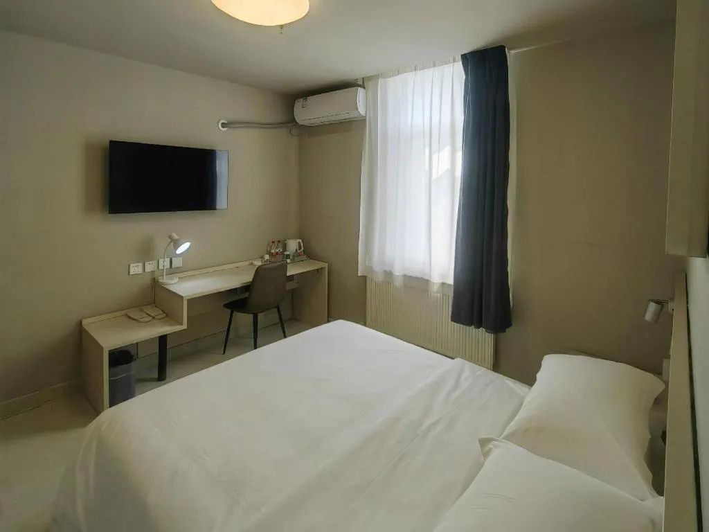 Bed in Jinjiang Inn Qingdao International Exhibition Center Haier Road