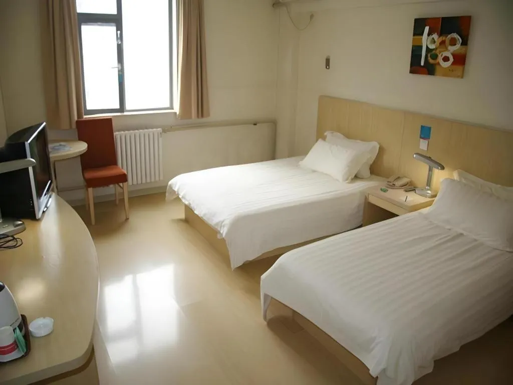 Bed in Jinjiang Inn Qingdao International Exhibition Center Haier Road