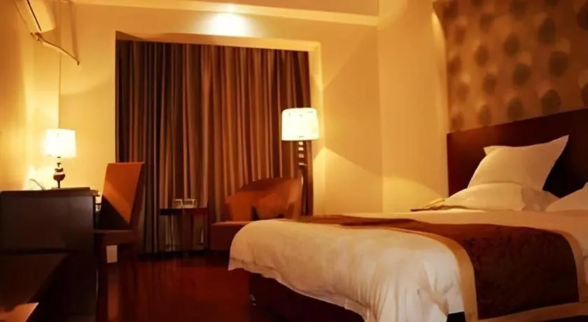 Bed in GreenTree Inn Jiuquan Century Plaza Hotel