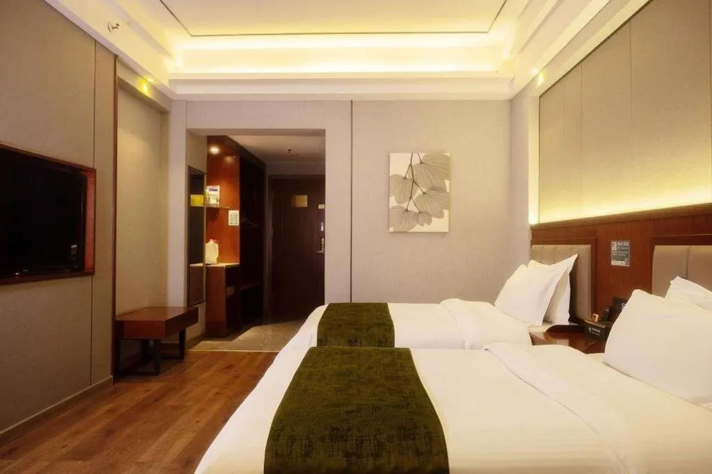 Bed in GreenTree Inn Jiuquan Century Plaza Hotel