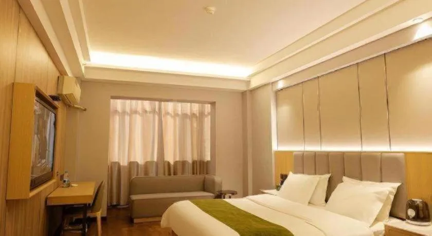 Bed in GreenTree Inn Jiuquan Century Plaza Hotel