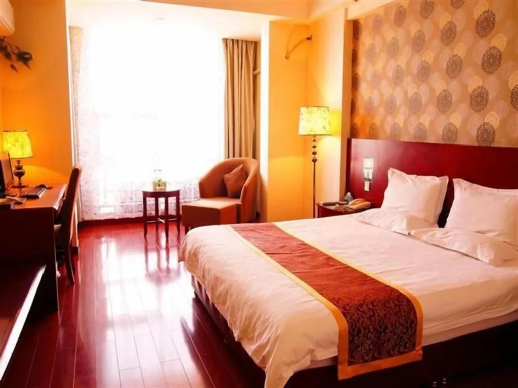 Bed in GreenTree Inn Jiuquan Century Plaza Hotel