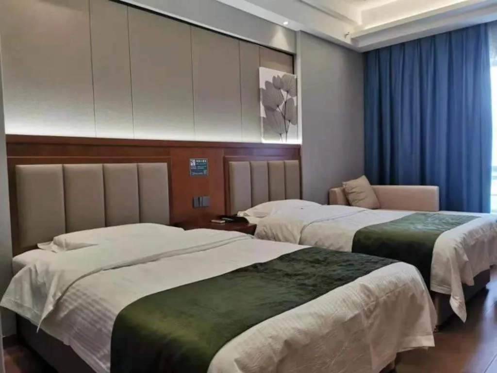 Bed in GreenTree Inn Jiuquan Century Plaza Hotel