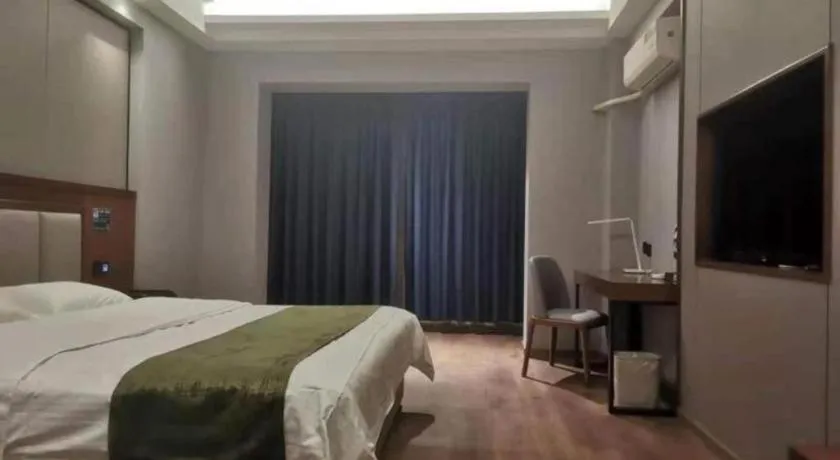 Bed in GreenTree Inn Jiuquan Century Plaza Hotel