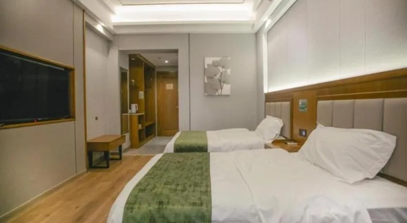 Bed in GreenTree Inn Jiuquan Century Plaza Hotel