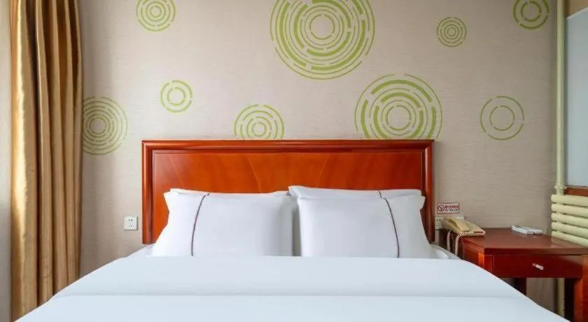 Bed in GreenTree Inn Yantai Xingfu Road Marina Plaza Express Hotel