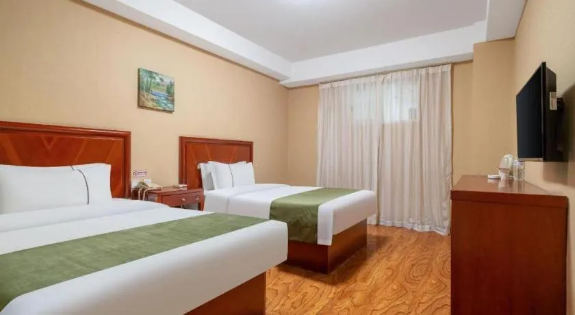 Bed in GreenTree Inn Yantai Xingfu Road Marina Plaza Express Hotel