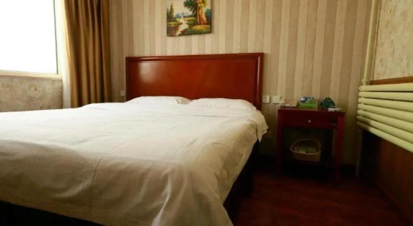 Bed in GreenTree Inn Yantai Xingfu Road Marina Plaza Express Hotel