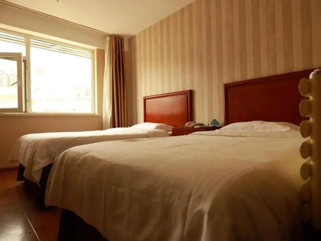 Bed in GreenTree Inn Yantai Xingfu Road Marina Plaza Express Hotel