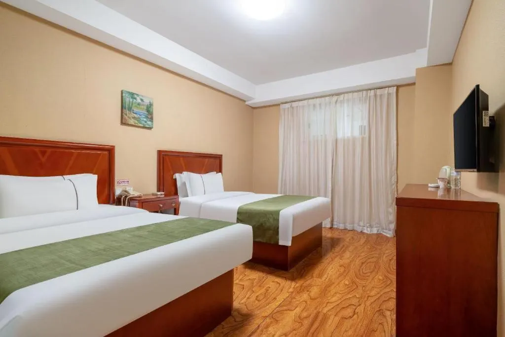 Bed in GreenTree Inn Yantai Xingfu Road Marina Plaza Express Hotel