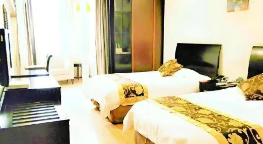 Bed in GreenTree Inn Taicang Baolong Square Hotel