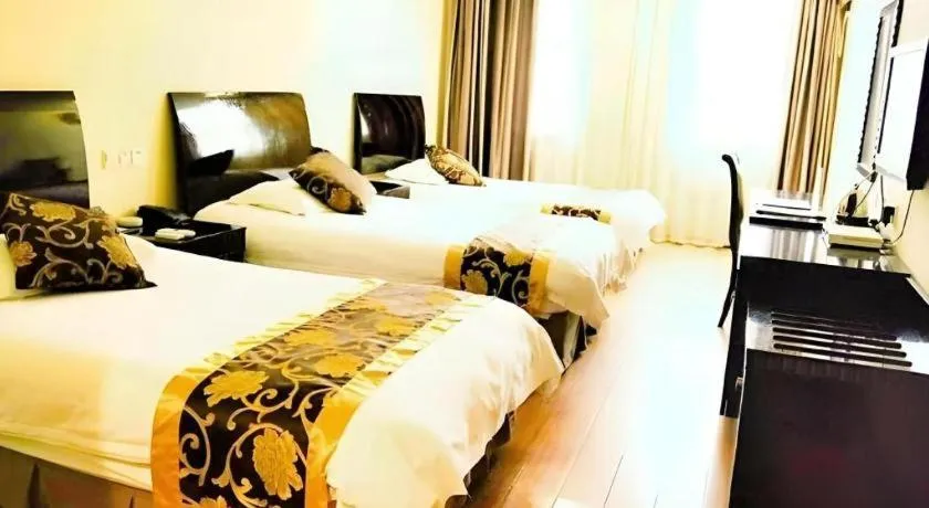 Bed in GreenTree Inn Taicang Baolong Square Hotel